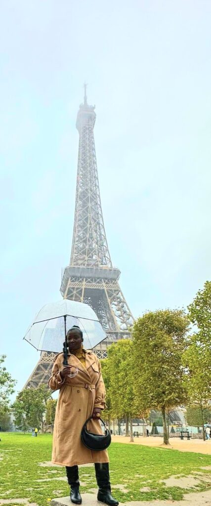 Tour Eifel (Tower) Poofbeegoneblog holding an umbrella posin.