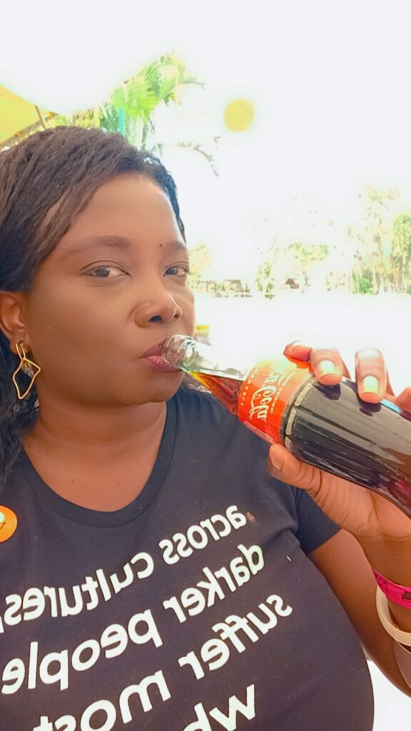 drinking a Coke at Cenote Ik Il
